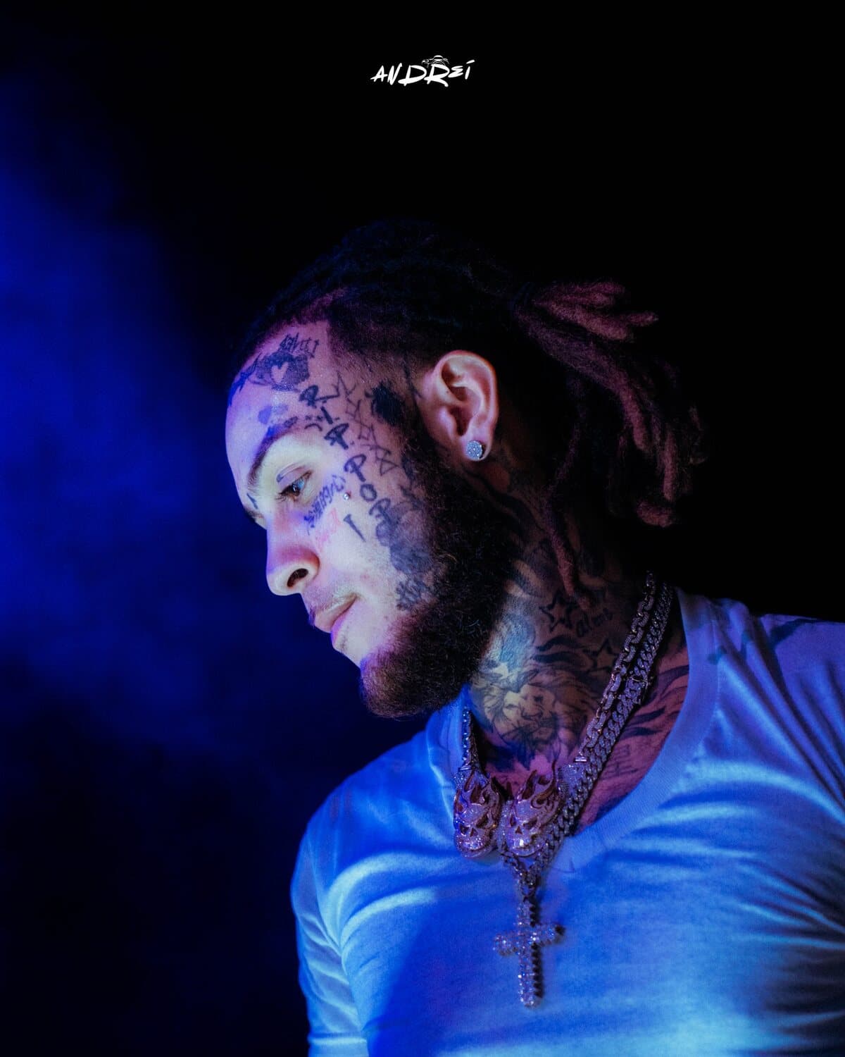 Lil Skies looking down, lit blue